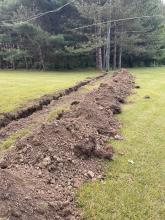 Trenching at receive site to run power to the link equipment